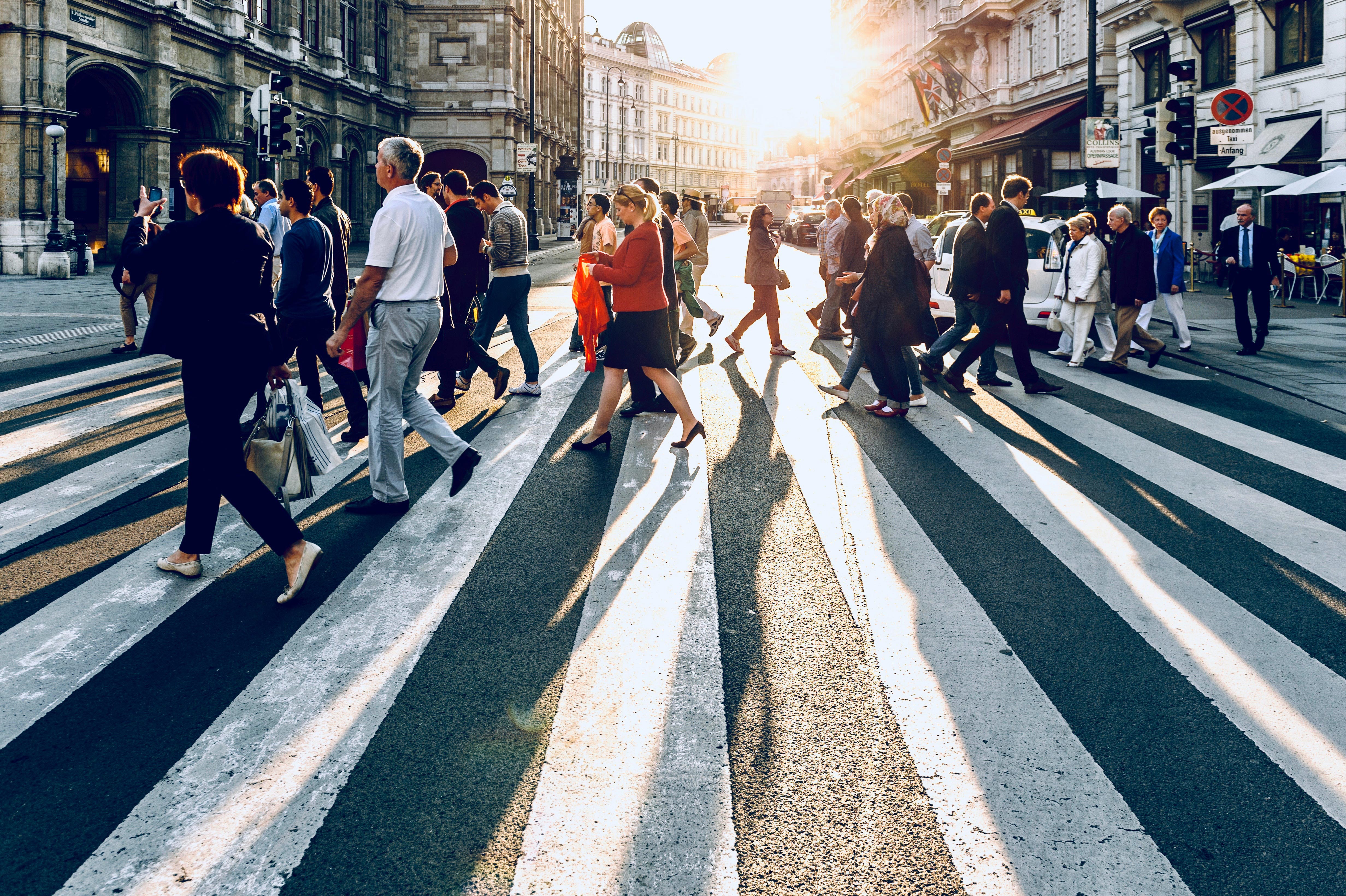 People walking on a NYC street crosswalk